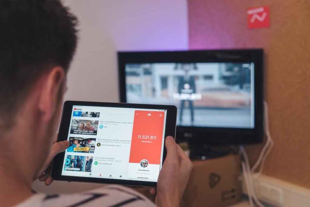 Man viewing YouTube on tablet computer