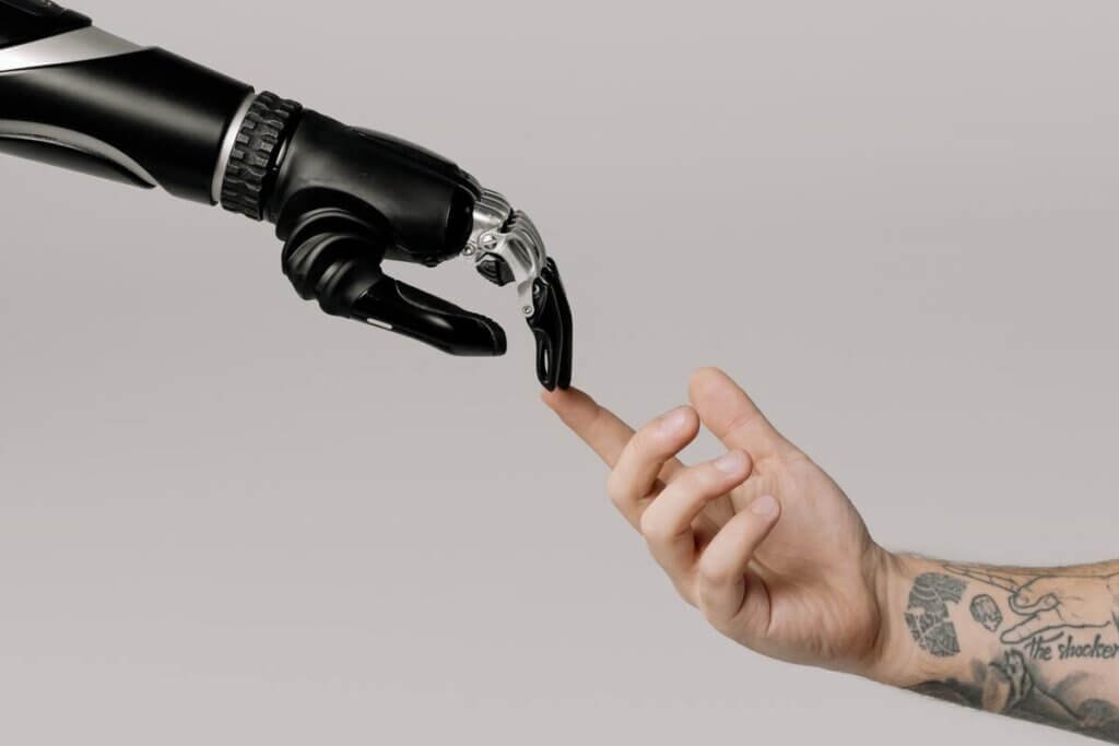 robot and human touching hands